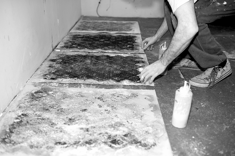 I check the alignment of the stencil to the fine art paper